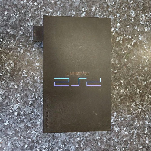 Sony PlayStation 2 console used with Thrustmaster racing wheel and accessories