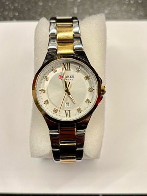 Curren watch used in silver and gold color