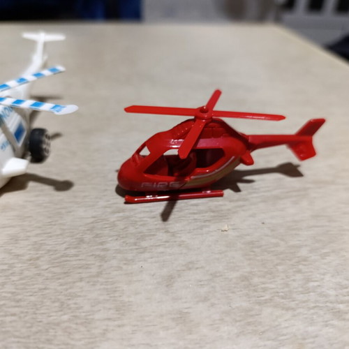 Plastic helicopter and train figures used