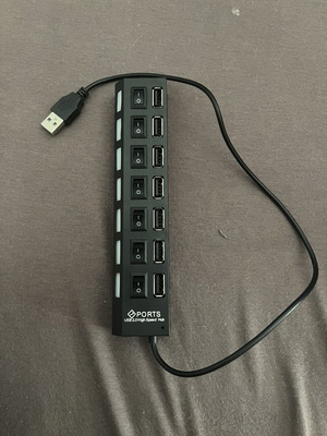 Accessory with multiple ports (7) like new with on-off switch and blue light
