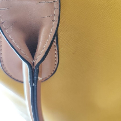 Yellow handbag used with beige details