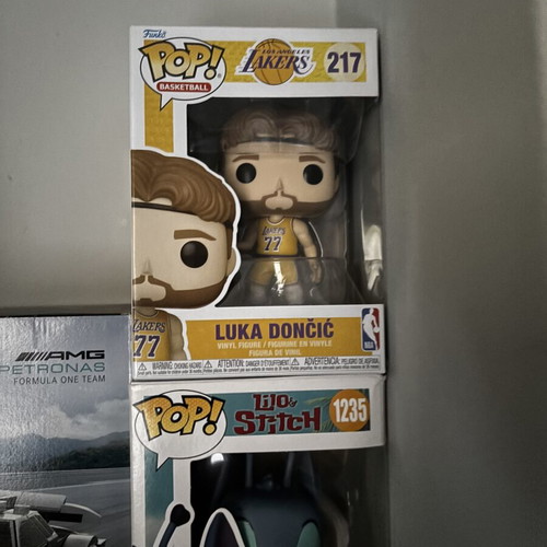 Funko Pop Luka Doncic and Stitch figures