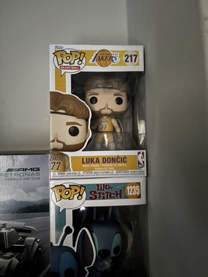 Funko Pop Luka Doncic and Stitch figures