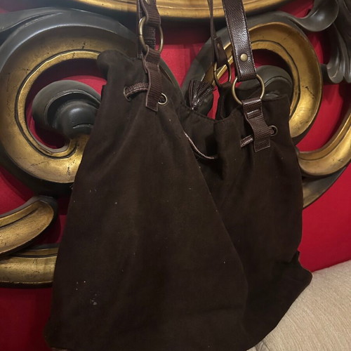 Brown suede shoulder bag used with woven details and drawstring
