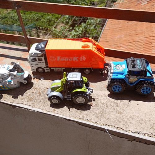 Lot of 4 used medium-sized children's toy vehicles