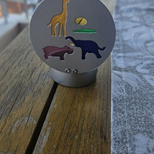 Metal tealight holder with stained glass animals