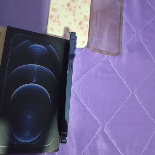 iPhone 12 Pro Max Pacific Blue 128GB like new with 7 cases and screen protectors