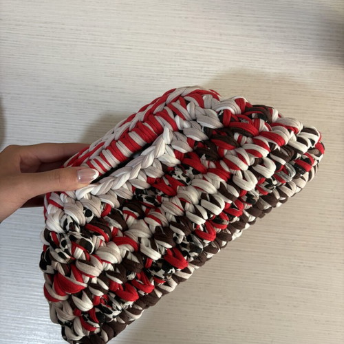 Handmade crochet clutch bag with fabric