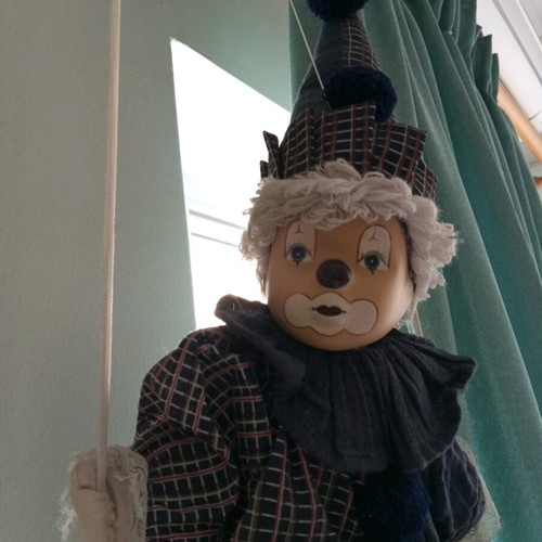 Decorative clown marionette like new, porcelain face and linen clothes
