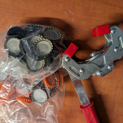Bottle capper used with 2 bags of caps for glass bottles