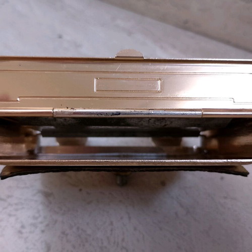 Vintage magnetic cigarette dispenser used, gold toned aluminum with leather panel