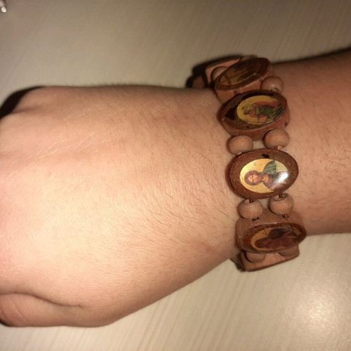 Bracelet with saint images like new with elastic cord