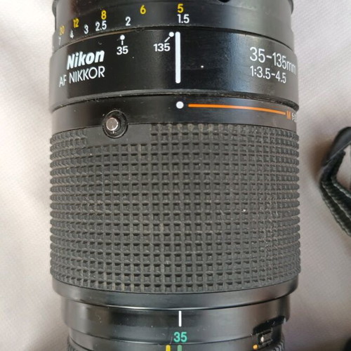 Nikon F301 camera used with 35-135 lens and flash