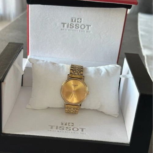 Tissot gold watch