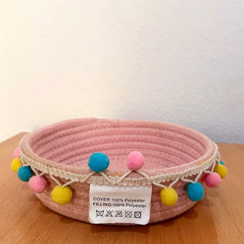 Handmade pink basket with colorful pom poms like new