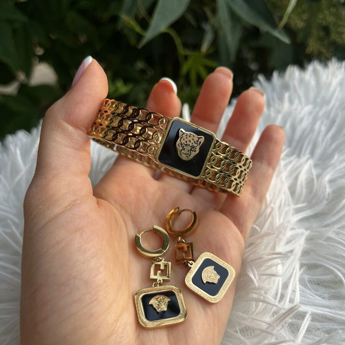 Princess stainless steel bracelet and earrings set like new, black and gold