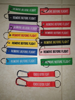 Remove before flight keychains new, various colors, from 4 each
