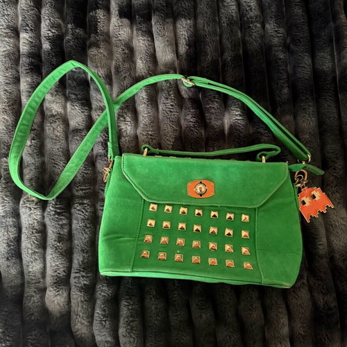 Green suede crossbody bag used with gold details