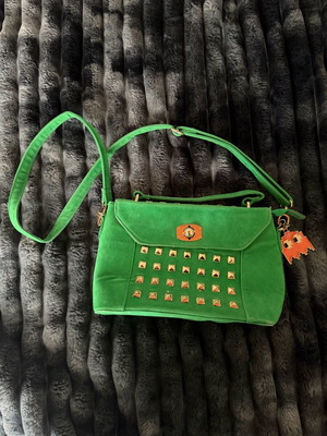 Green suede crossbody bag used with gold details