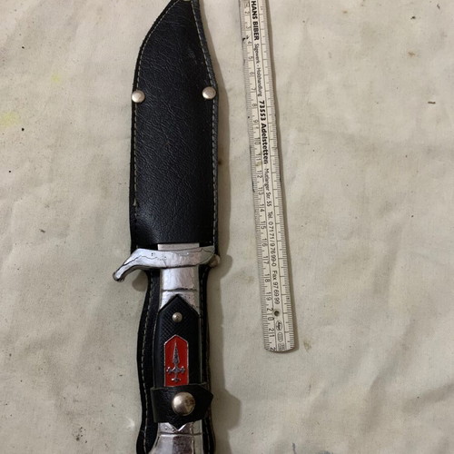 Decorative knife used with sheath and cracked aluminum handle