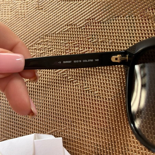 Nina Ricci SNR097 sunglasses like new, black oval acetate frame with chain design
