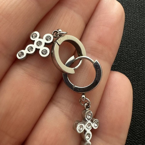 Silver huggie hoop earrings with rhinestone cross pendant