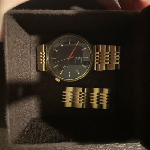 Replay wristwatch like new with black dial and gold bracelet