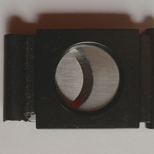 Black plastic cigar cutter used with metal cutting edges