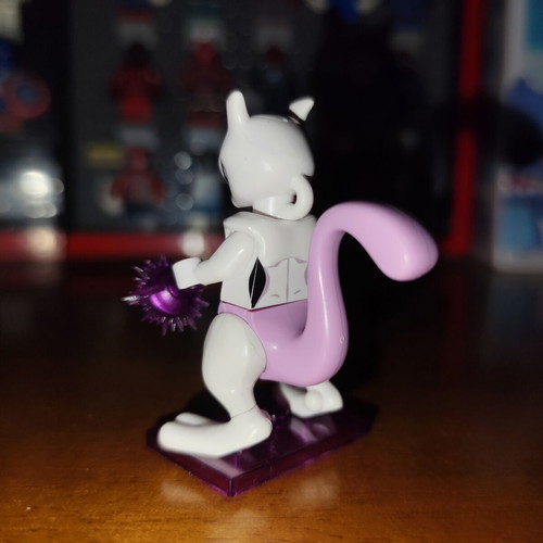 Mewtwo Pokemon figure with purple energy blast base