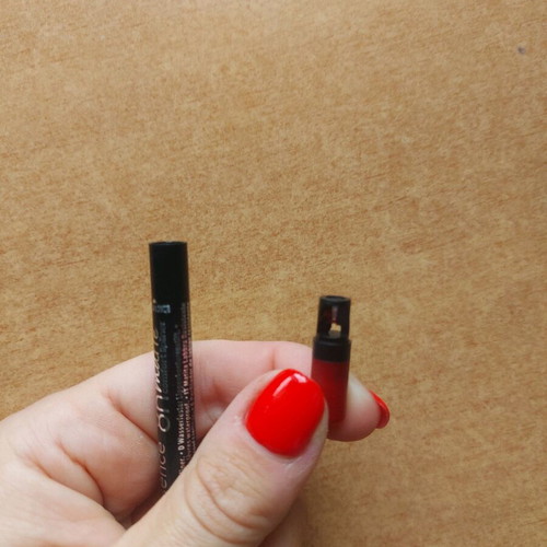 Mechanical lip pencil used, deep red with sharpener