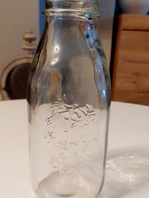 Glass bottle Frutta del Prato like new with embossed floral design
