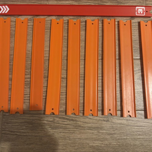 Hot Wheels track set with orange straight and colored action pieces
