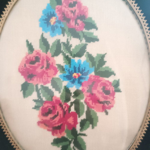 Vintage handmade cross-stitch frame with velvet oval border used