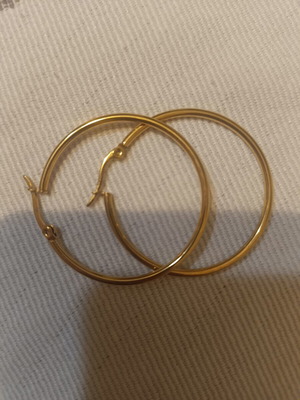 Steel hoop earrings like new, gold tone