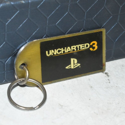 Uncharted 3 PlayStation keychain used, metal collectible