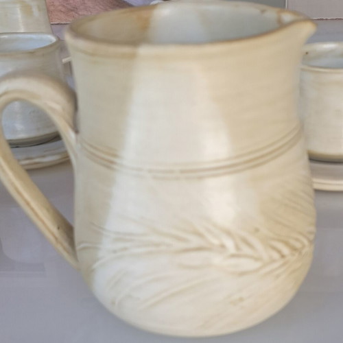 Porcelain coffee cup set with saucers, milk jug and sugar bowl