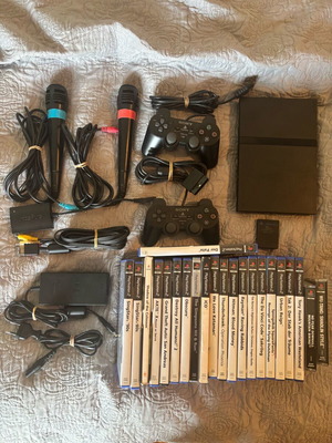 PlayStation 2 Slim console like new with 12 games and extras