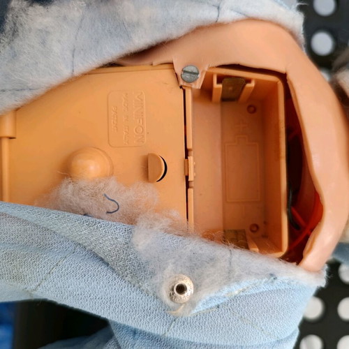 Vintage baby doll used with missing parts and wear