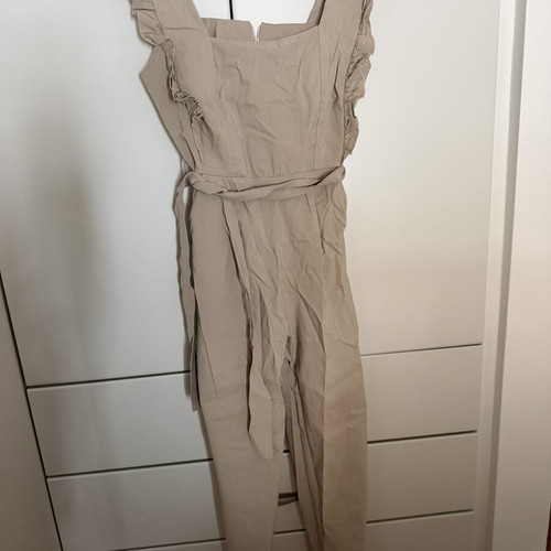 Jumpsuit with ruffles beige, one size, like new
