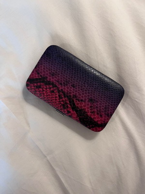 Urban Outfitters wallet used with snake print in pink and purple