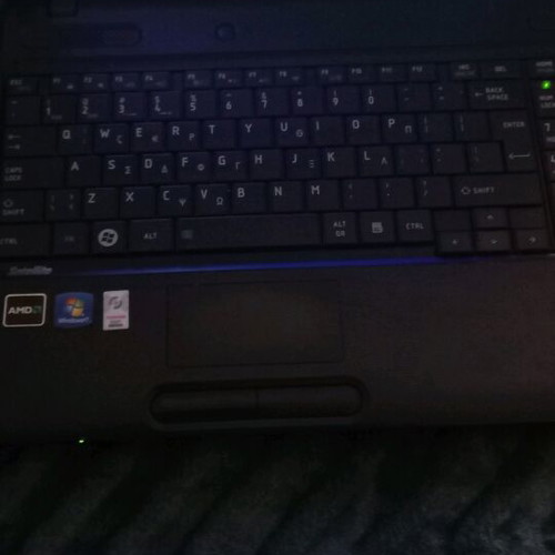 Toshiba Satellite C660D-10D laptop used with charger and accessories