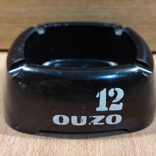 Ouzo 12 square black plastic ashtray used