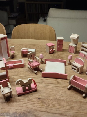 Wooden dollhouse furniture used with opening doors and details
