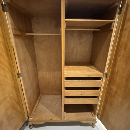 Wooden double-door wardrobe with internal drawers