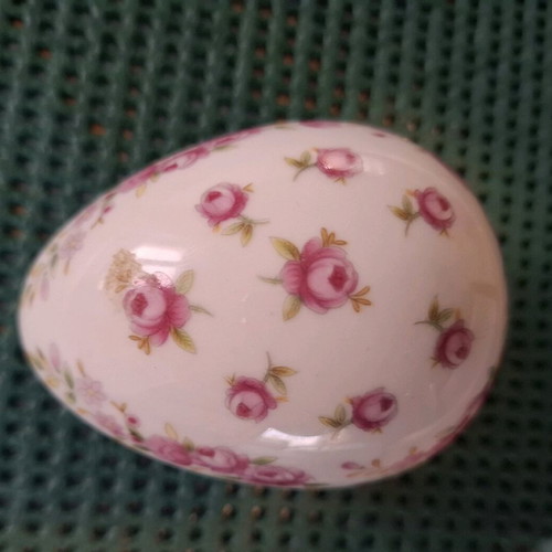 Porcelain decorative container used, small egg with pink flowers