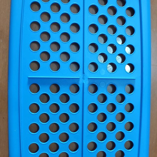Kitchen utensils used, strainer in tupperware with lids