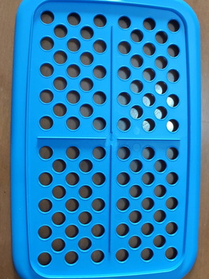 Kitchen utensils used, strainer in tupperware with lids