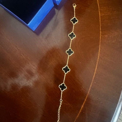 Bracelet with black clovers new, gold plated
