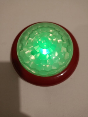 Buzzer toy used with flying and musical statues