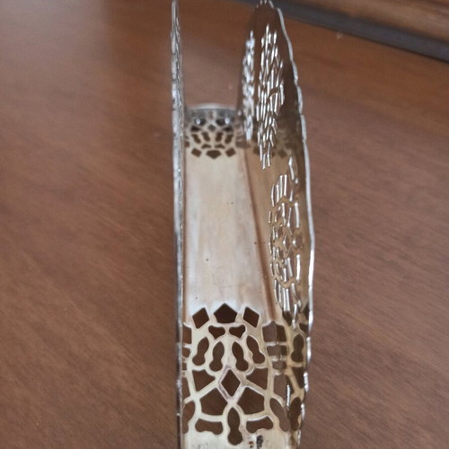 Napkin holder like new, silver with intricate cutout design